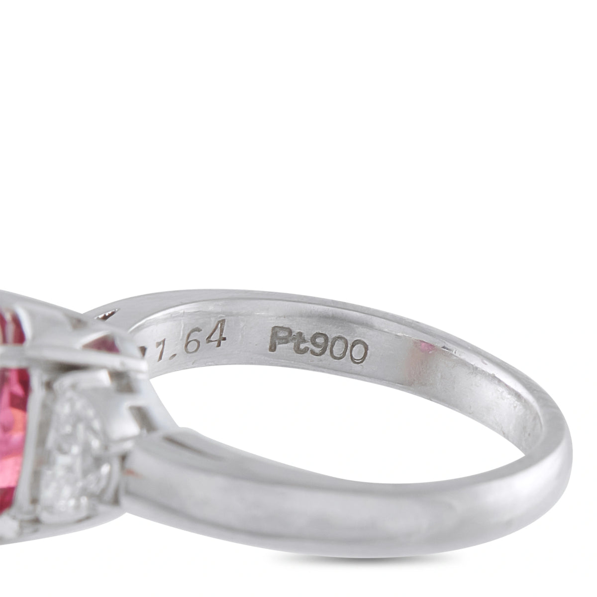 Platinum ring band close-up showing the 1.64 and Pt900 engravings
