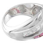 Platinum crossover ring interior with engraved markings and ruby accents