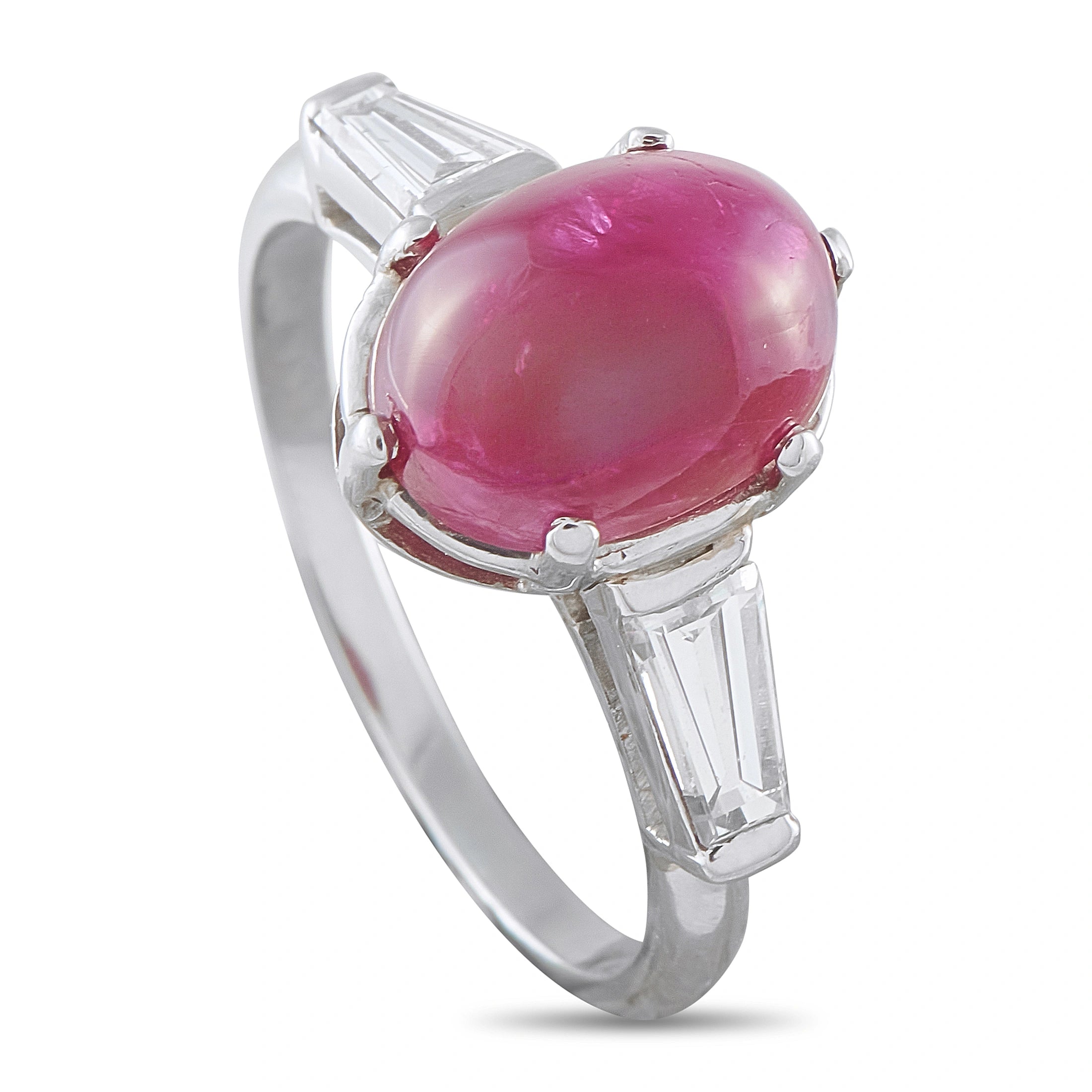 Platinum-toned ring with oval pink cabochon ruby and baguette diamond accents