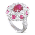 Platinum ring with oval pink ruby center and round diamond accents
