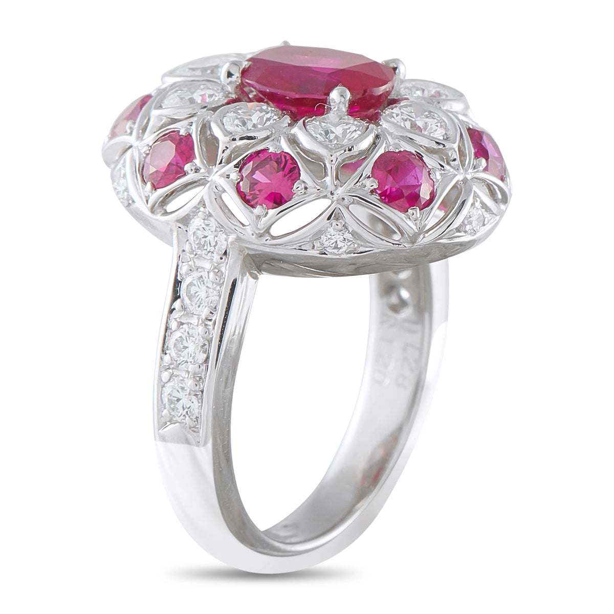Platinum ring with pink ruby stones in floral halo and diamond detailing