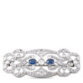 Diamond and sapphire brooch, oval filigree with three blue stones, silver-toned pin back
