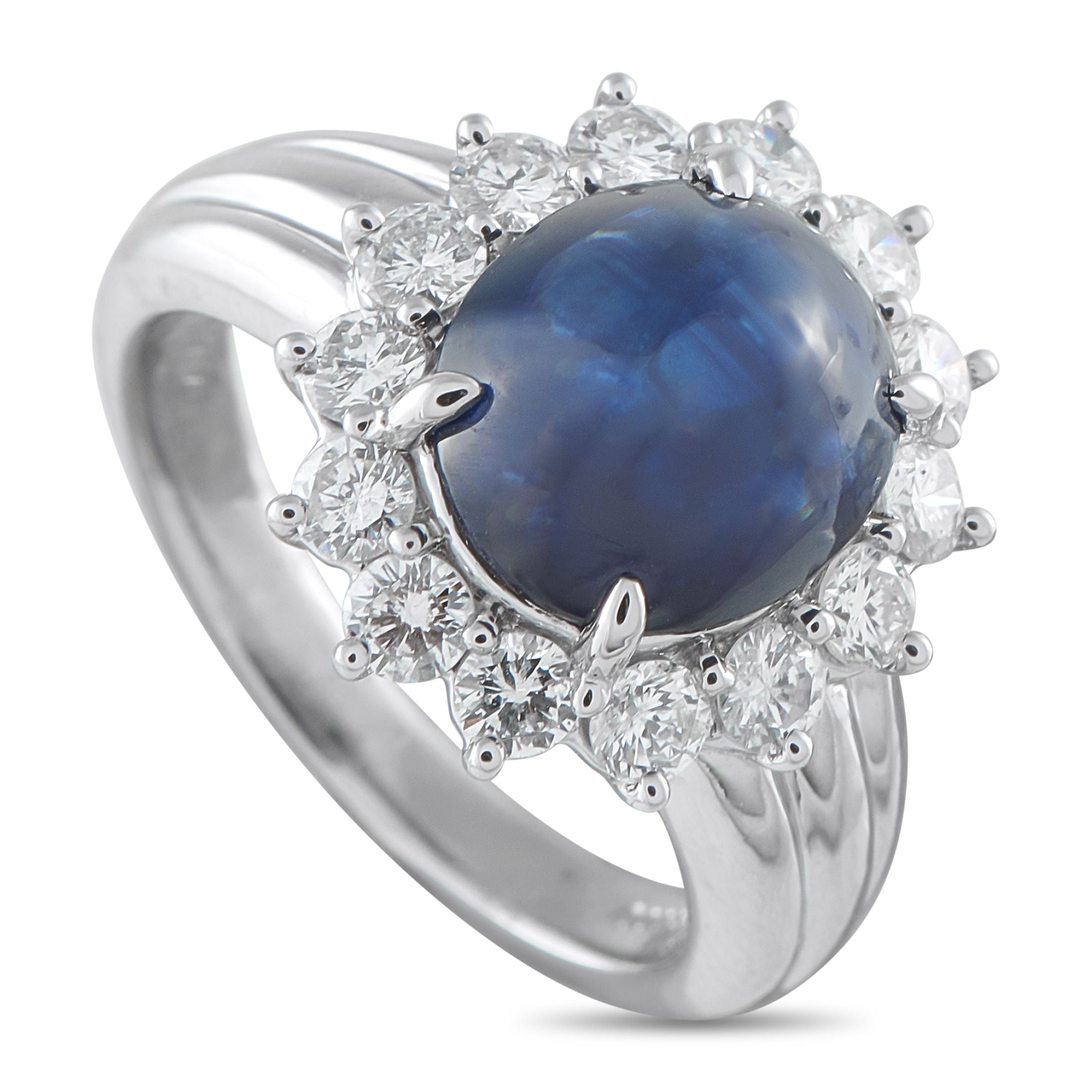 Platinum 0.92ct Diamond and Sapphire Ring - Making a sophisticated statement, this  ring carries a substantial 4.43-carat sapphire cabochon at its core. The velvety blue