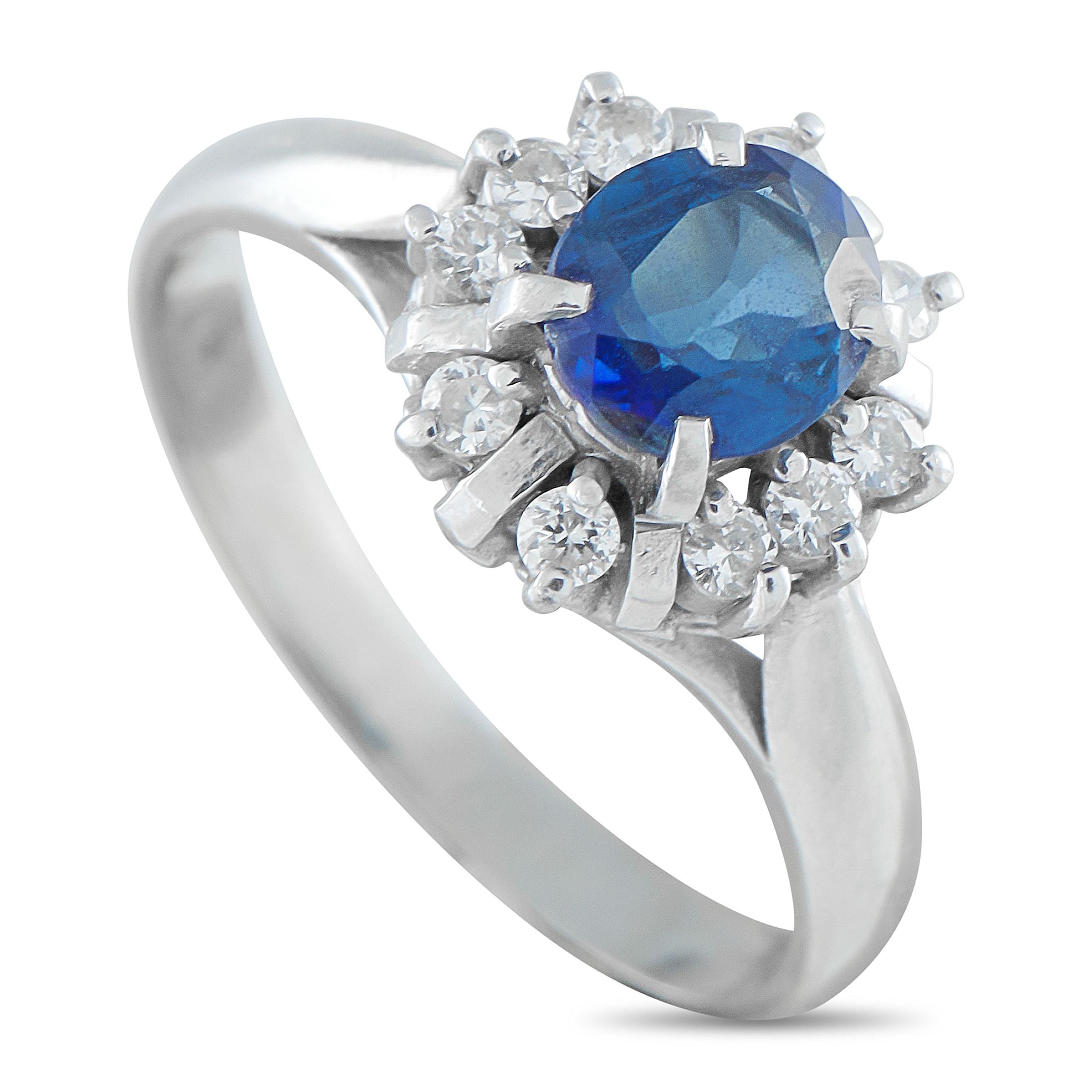 Exclusive Platinum 0.20ct Diamond and Sapphire Ring - A 0.82-carat oval sapphire rises on four prongs above a cathedral shank, commanding attention with its deep blue hue. Round d