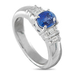 Exclusive Platinum 0.40ct Diamond and Sapphire Ring - A 1.32-carat oval sapphire serves as the focal point, held securely by four prongs that balance protection with visibility. F