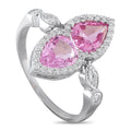 Platinum ring with oval pink center stone and diamond halo accents, split prong setting