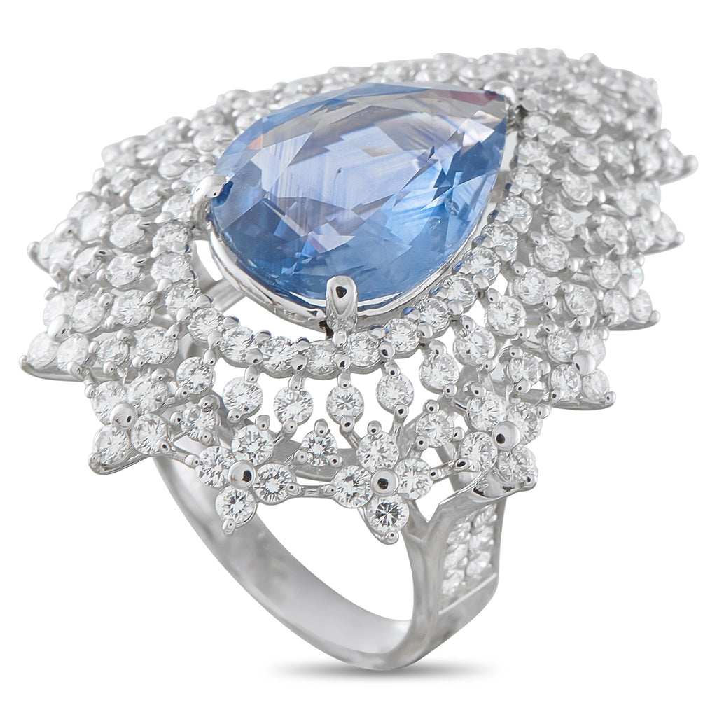 Platinum diamond and sapphire ring with a large pear-shaped blue sapphire and clustered diamonds.