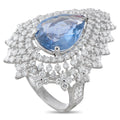 Platinum diamond and sapphire ring with a large pear-shaped blue sapphire and clustered diamonds.