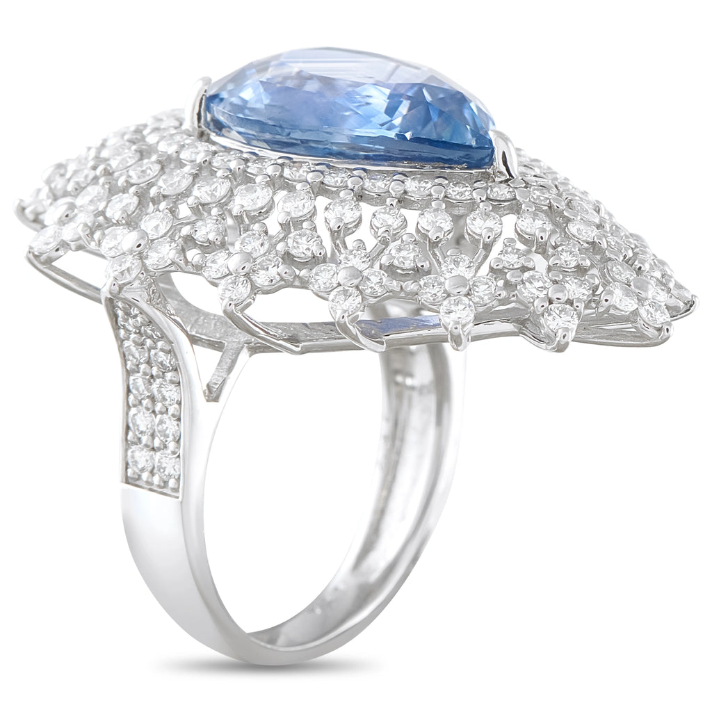 Platinum ring with a blue sapphire and pavé diamond floral setting
