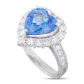 Platinum heart-shaped sapphire ring with a diamond halo and diamond-set shoulders