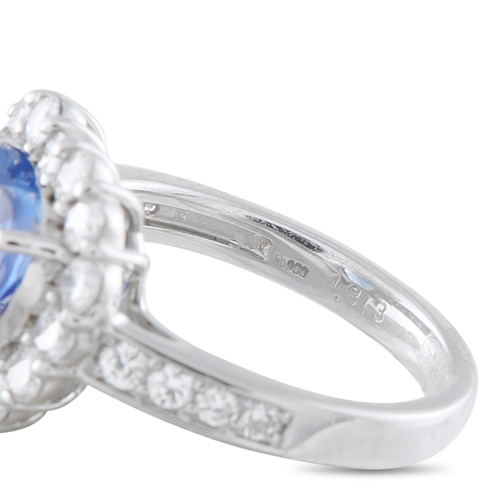 Platinum ring band with diamond-set shoulder and visible hallmark