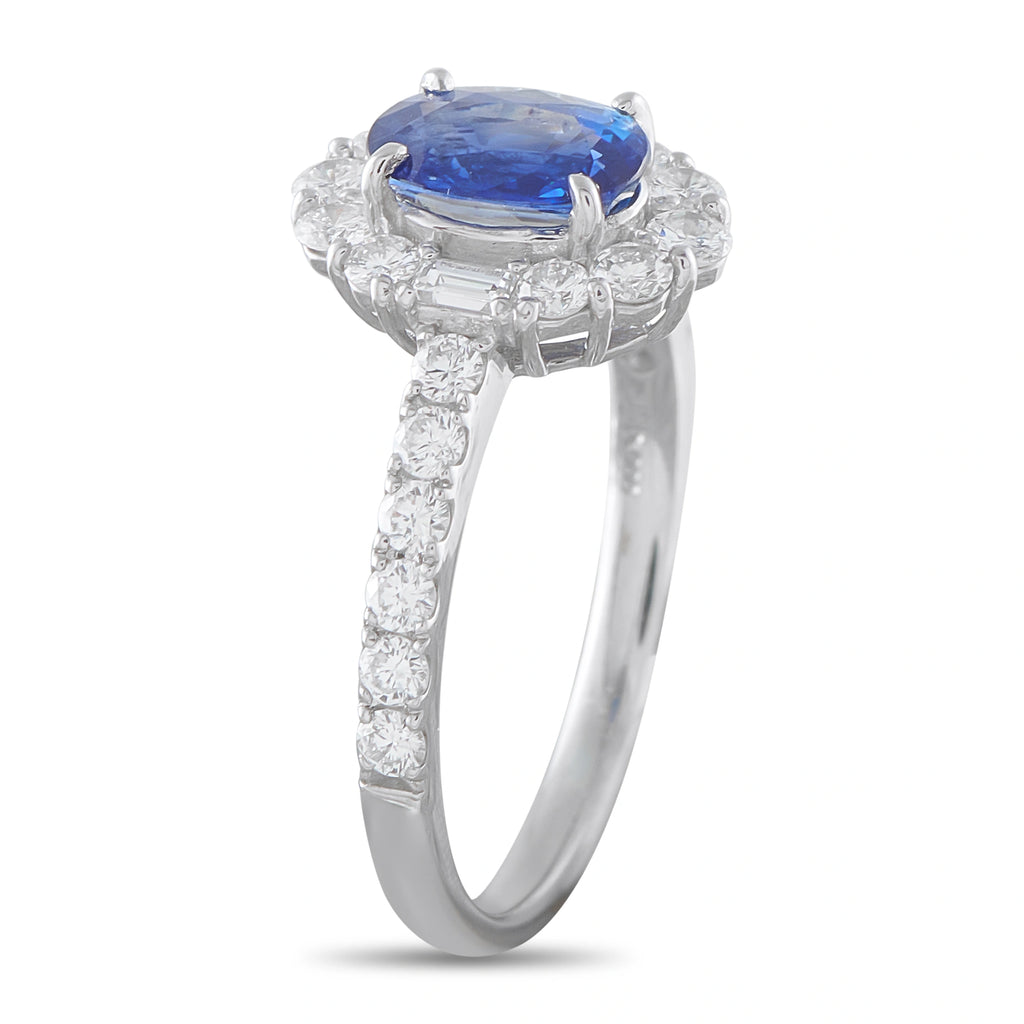 Platinum ring with oval blue sapphire haloed by diamonds and diamond band