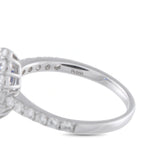 Platinum ring with pave diamond band and prong-set setting