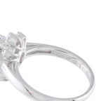 Close-up of platinum ring band with engraved marks and prong setting
