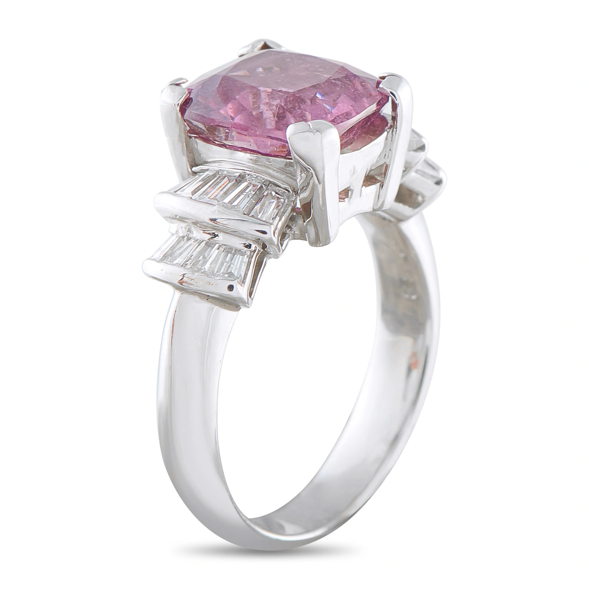 Platinum ring side view showing pink spinel, diamond accents and raised prongs