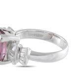 Platinum ring close-up showing the polished band and diamond-set shoulders