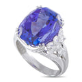 Platinum ring with a large cushion-cut blue tanzanite and clusters of diamond accents