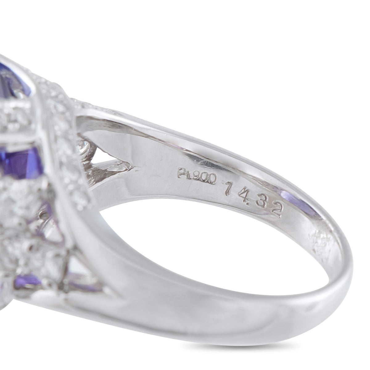 Platinum ring band detail showing the Pt900 hallmark and a partial view of the gemstones