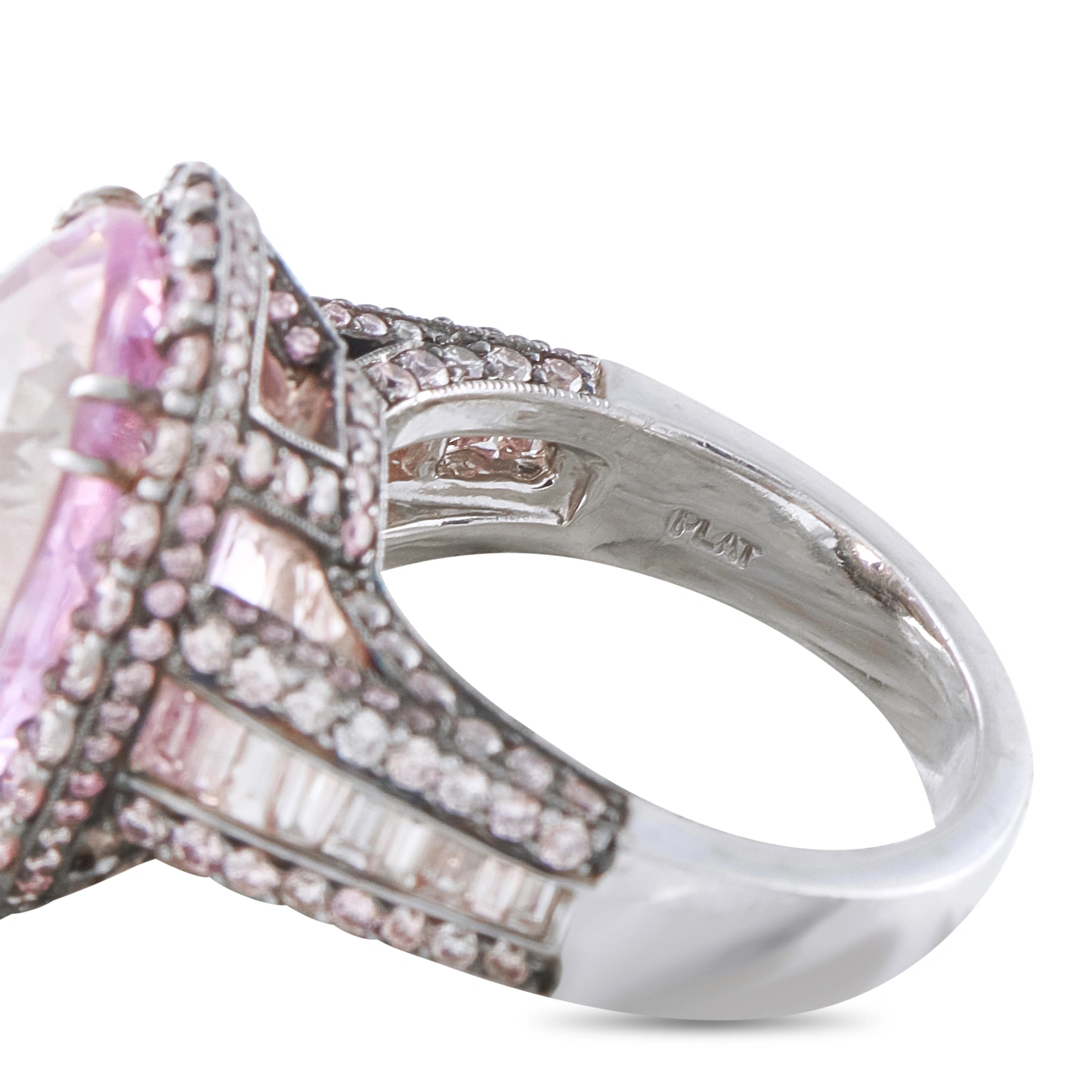 Platinum ring with pink center stone, diamond accents, and kunzite side stones