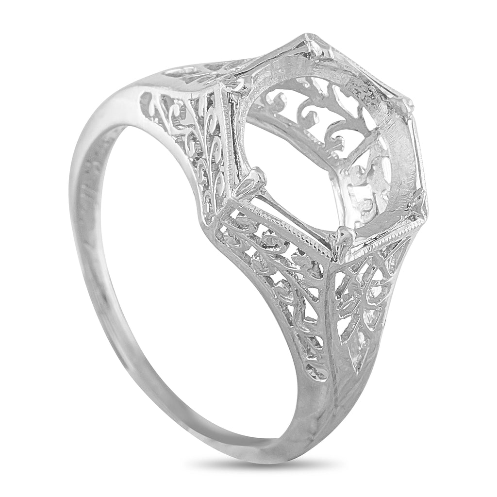 Antique platinum ring with an openwork setting and ornate filigree band