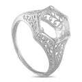 Antique platinum ring with an openwork setting and ornate filigree band
