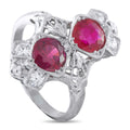 Antique platinum ring with two oval ruby gemstones and clear diamond accents