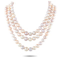Pink pearl and gold necklace with layered strands of round pearls