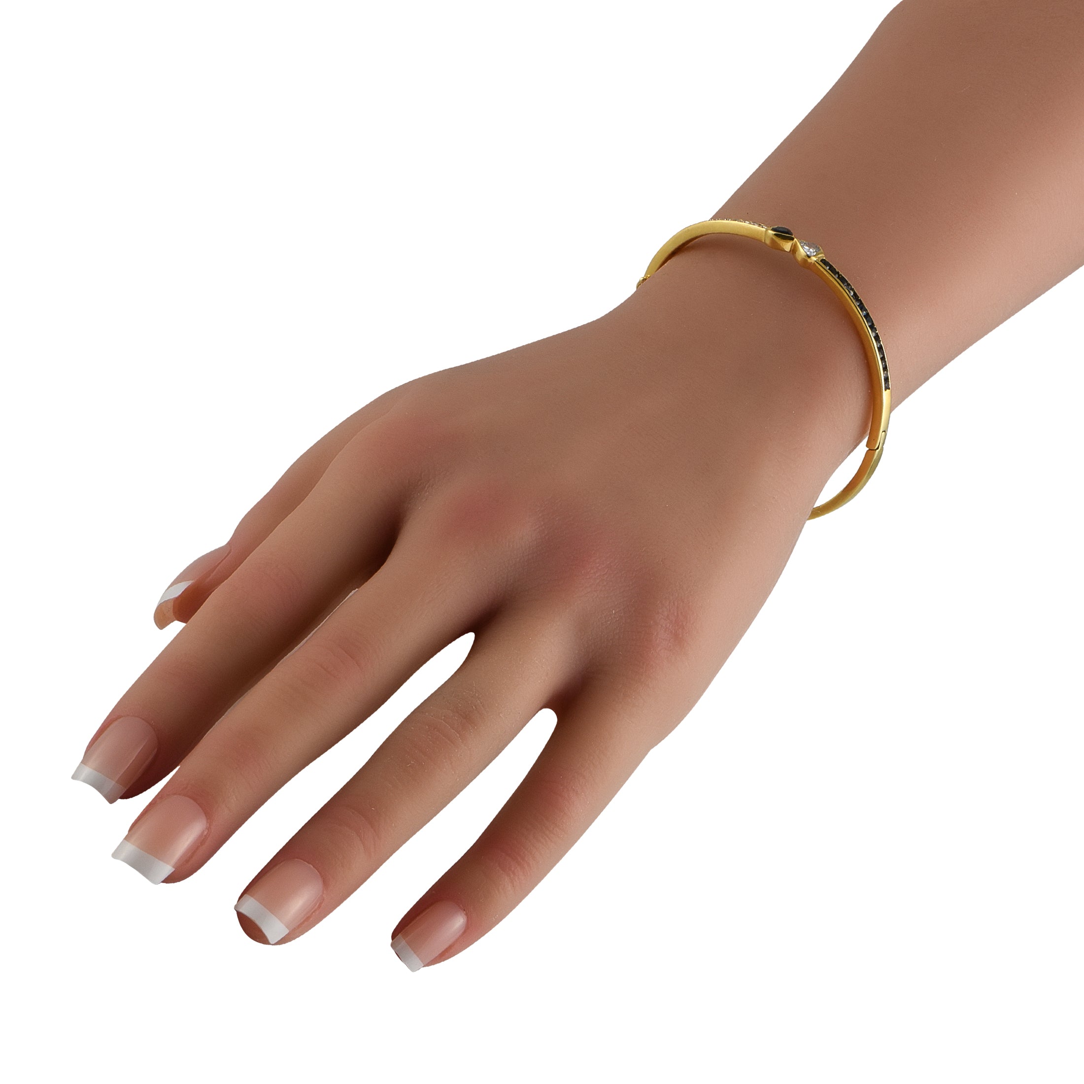 18K yellow gold bracelet with diamond and sapphire accents, worn on hand