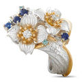 Floral diamond and sapphire ring in platinum with yellow gold accents