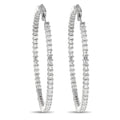 Inside-out hoop earrings in white metal with baguette diamond rows