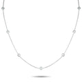 White gold diamond station necklace with round bezel settings on a fine chain