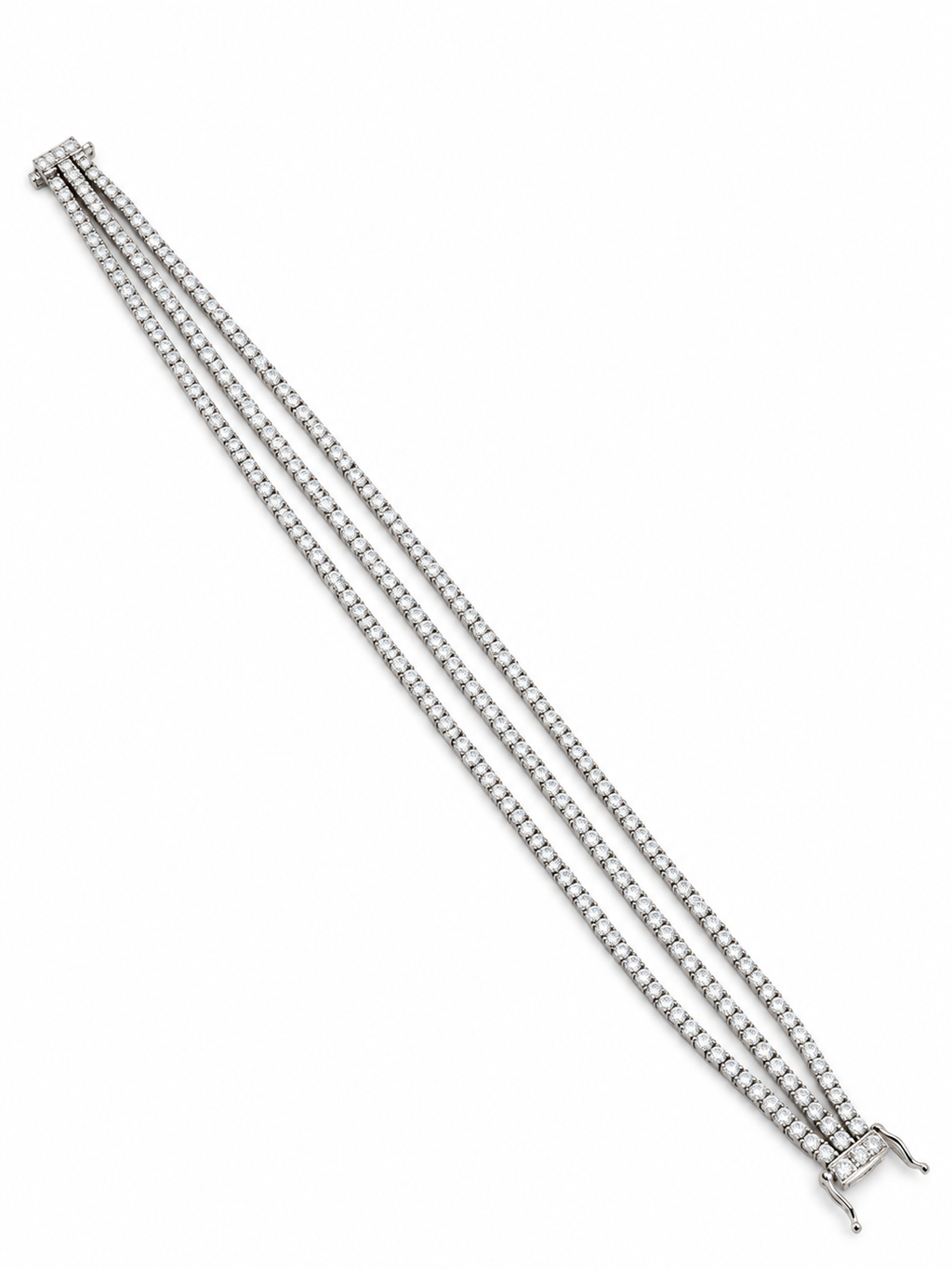 Three-row diamond tennis bracelet with white gold setting and end clasp.