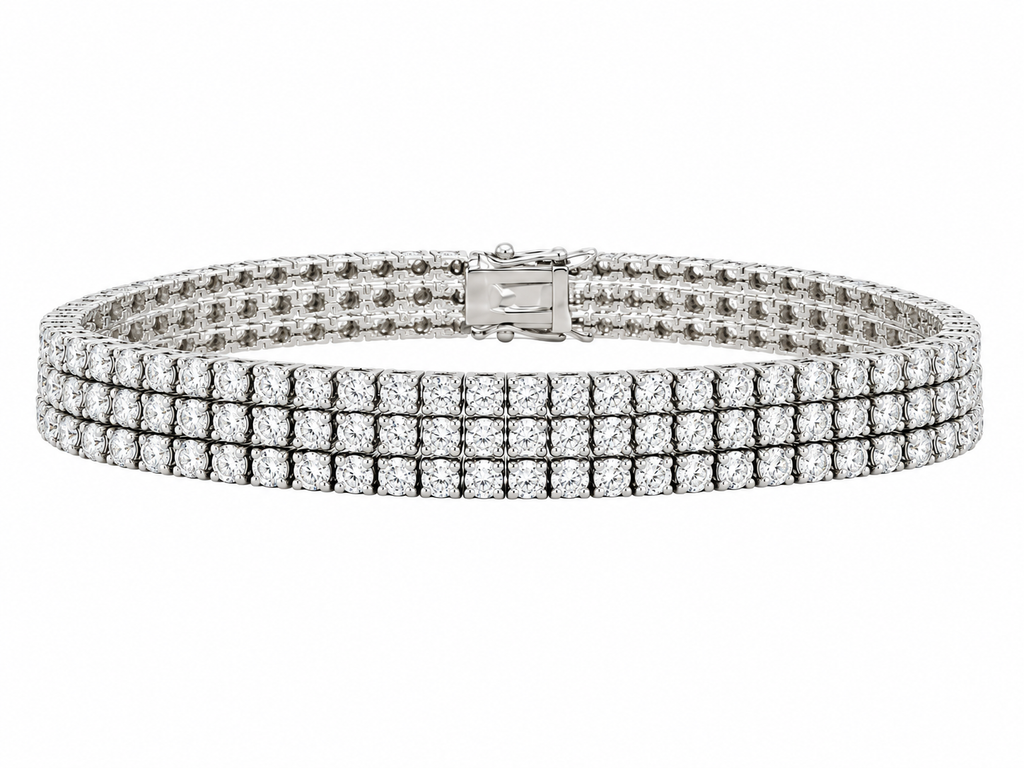 White gold tennis bracelet with three diamond rows and a fold-over clasp.