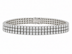 White gold tennis bracelet with three diamond rows and a fold-over clasp.
