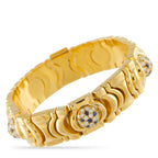 18K yellow gold bracelet with repeating fan links, diamond and sapphire accents