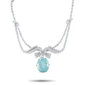 Platinum necklace with curved diamond rows and an oval blue-green gemstone pendant