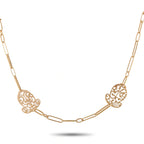 18K rose gold sautoir necklace with filigree medallion stations and curb chain links
