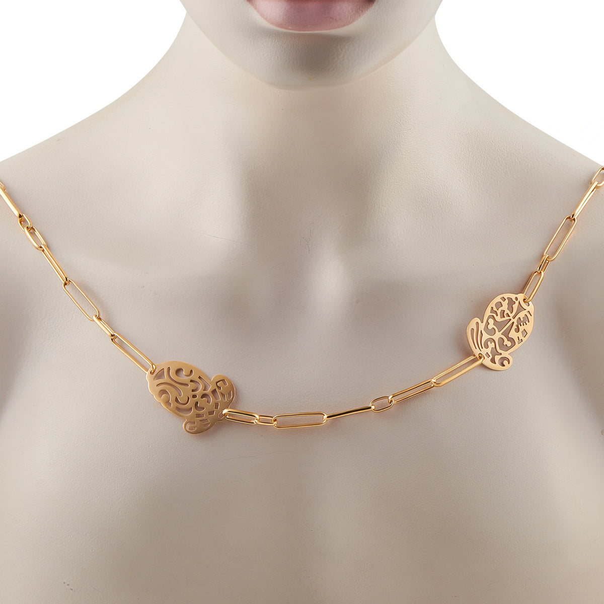 18K rose gold sautoir necklace worn on neck, filigree medallion stations on chain
