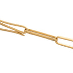 Rose gold sautoir necklace chain link close-up with interlocking bars and engraved detail
