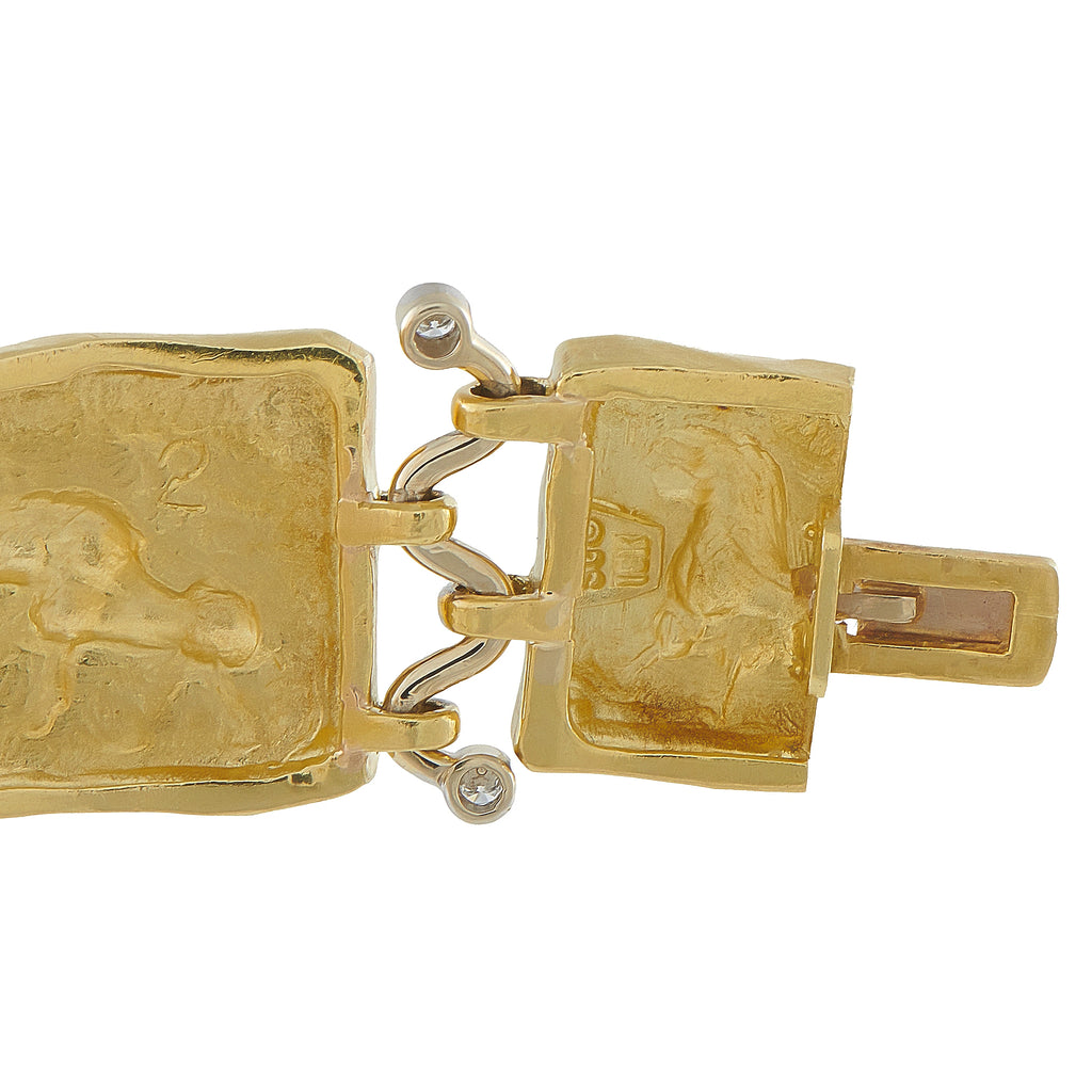 Yellow gold clasp bracelet with engraved square links and small diamond detail