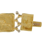 Yellow gold clasp bracelet with engraved square links and small diamond detail