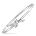 18K white gold diamond bangle with knot motif, pavé and center-cut stones