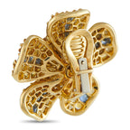 18K yellow gold flower earrings with blue stone petals and green cabochon center