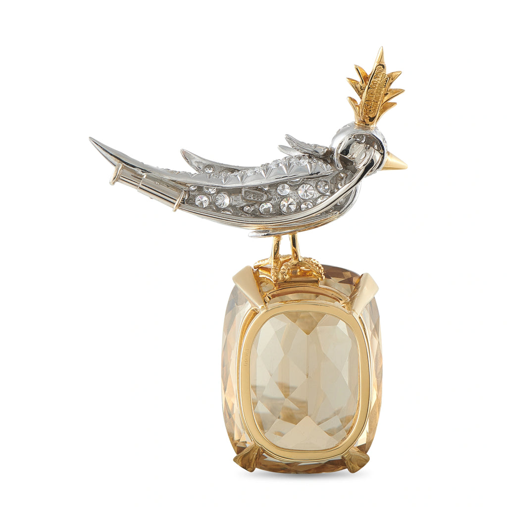 Tiffany & CO. bird brooch with silver bird and gold faceted gemstone base