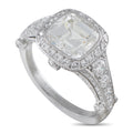 Tiffany & Co. platinum diamond ring with oval center stone and diamond halo setting