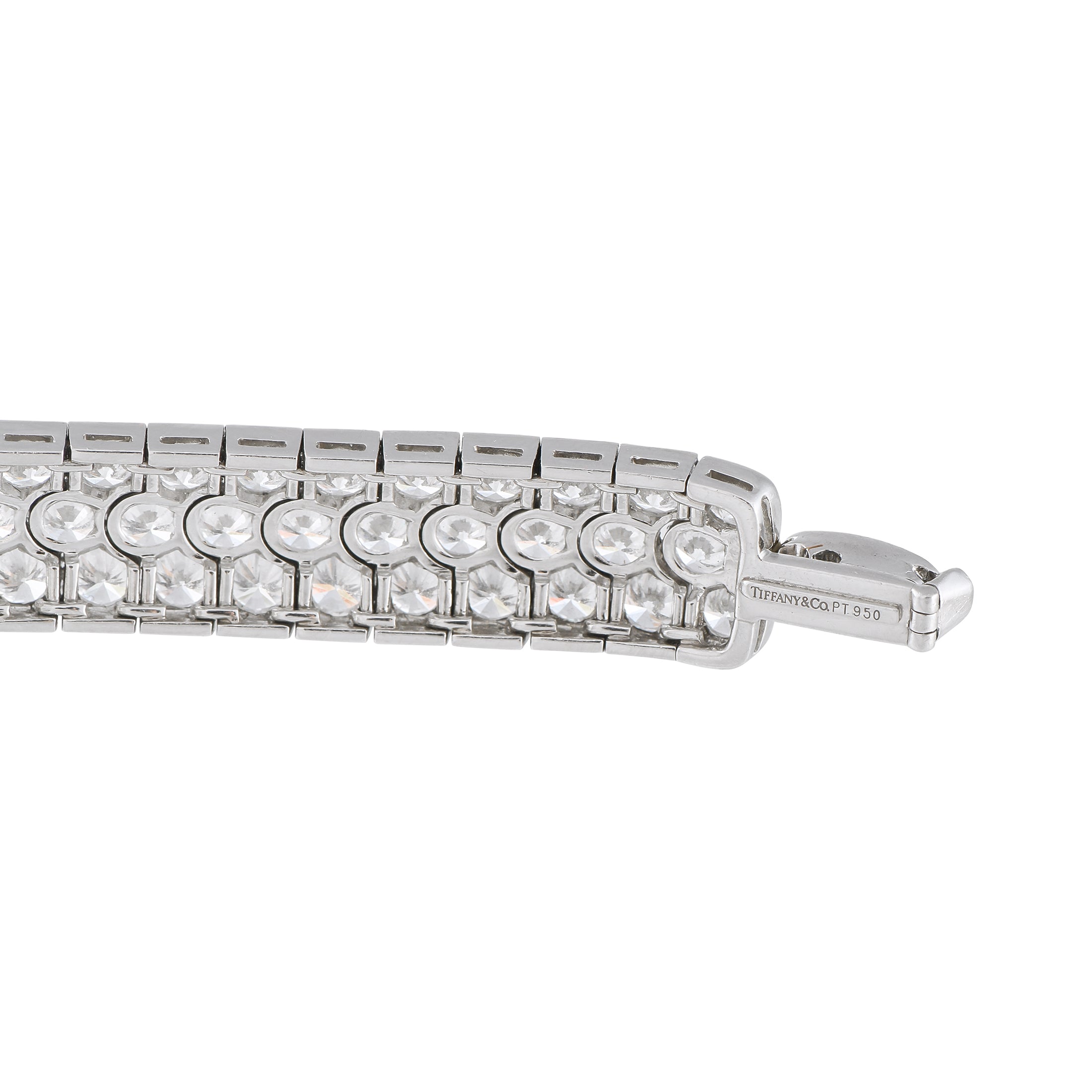 Engraved platinum diamond tennis bracelet with round stone row and clasp detail