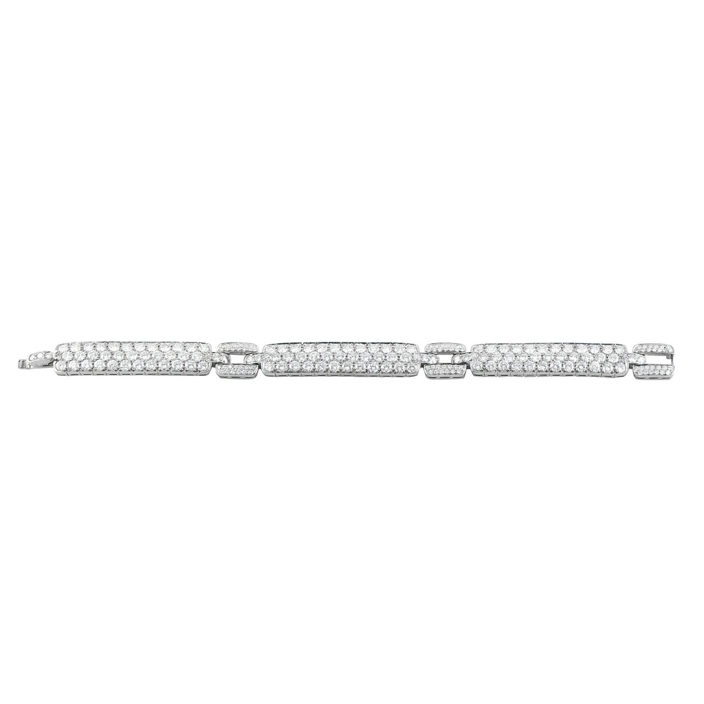 Platinum diamond bracelet laid flat with multiple rows of round stones and links