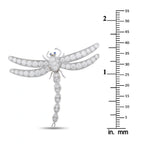 Platinum diamond dragonfly brooch with blue eye accent shown next to size scale in mm
