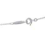 Platinum necklace clasp with circular link and small gold-toned accent