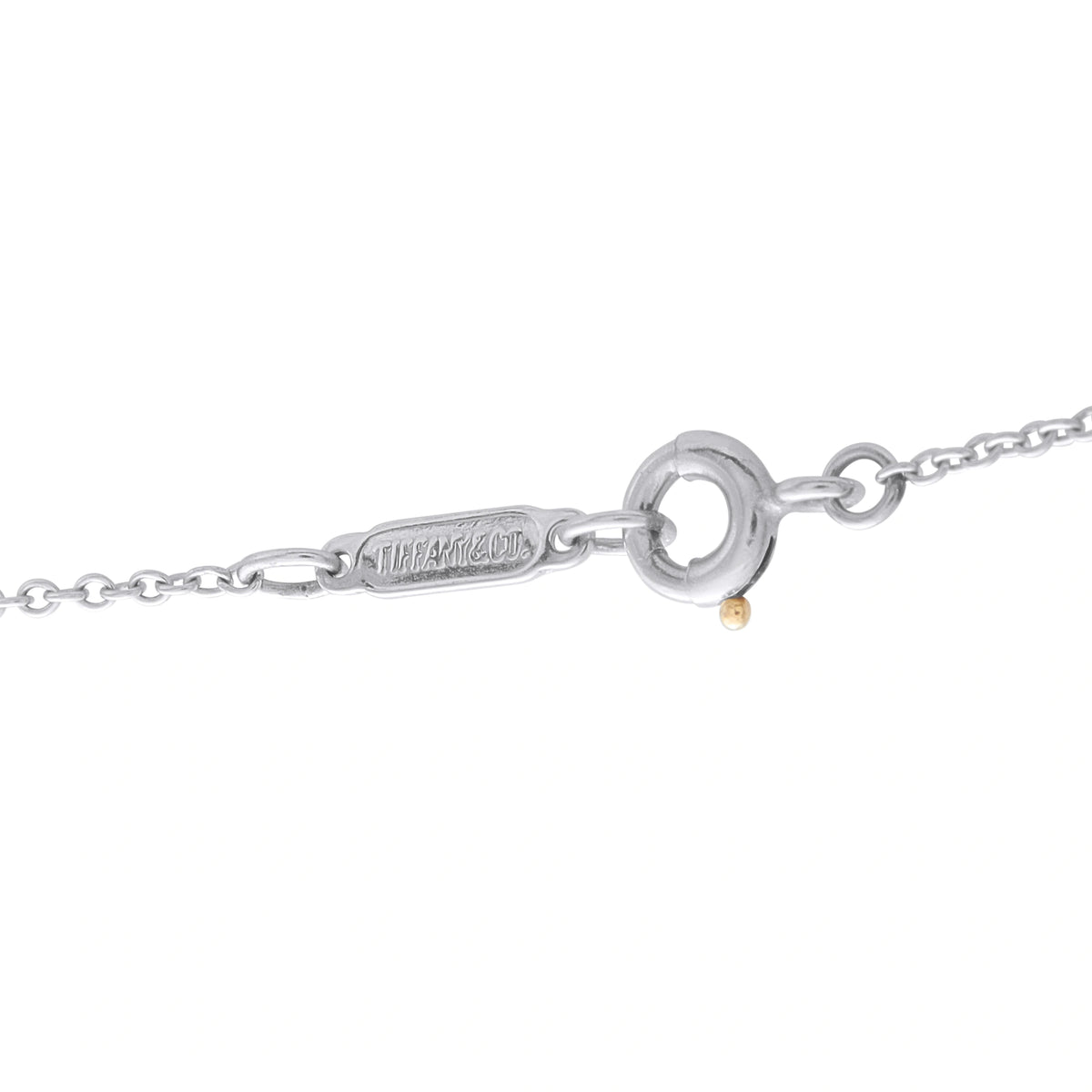 Platinum necklace clasp with circular link and small gold-toned accent